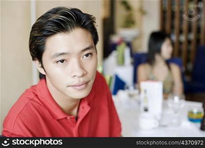 Close-up of a young man in a restaurant
