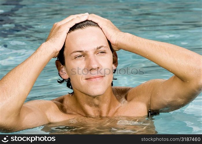Close-up of a young man in a swimming pool