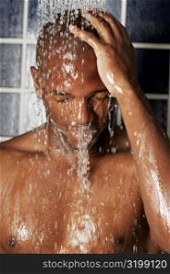 Close-up of a young man in the shower
