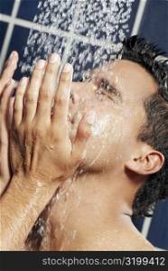 Close-up of a young man in the shower