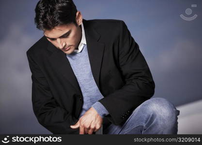 Close-up of a young man looking down