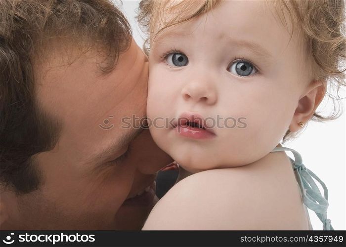 Close-up of a young man loving his daughter