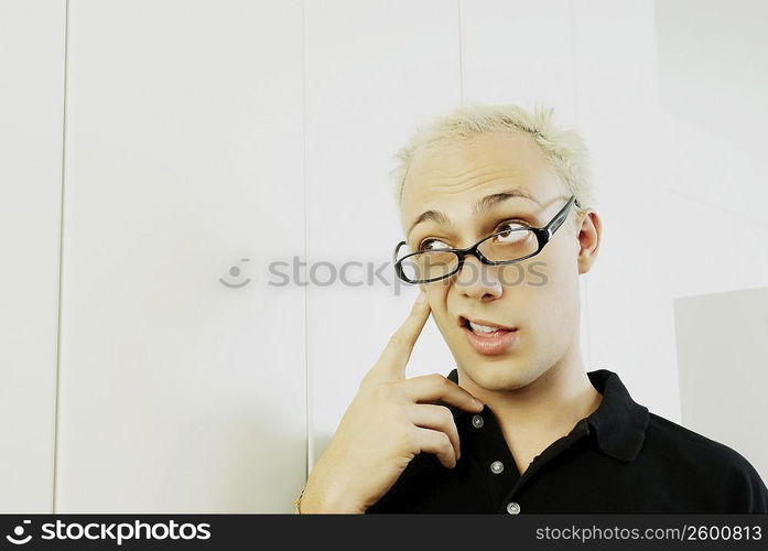 Close-up of a young man making a face