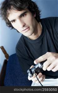 Close-up of a young man playing a video game