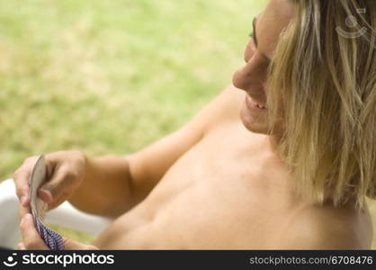 Close-up of a young man playing cards