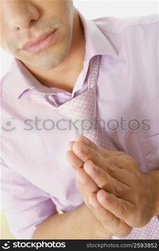Close-up of a young man praying