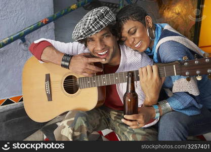 Close-up of a young man smiling with a young woman