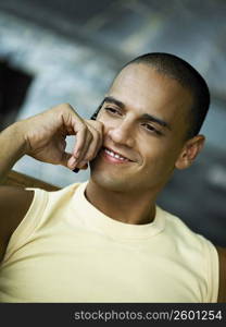 Close-up of a young man talking on a mobile phone