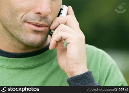 Close-up of a young man talking on a mobile phone
