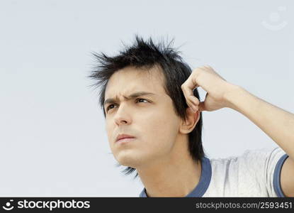 Close-up of a young man thinking