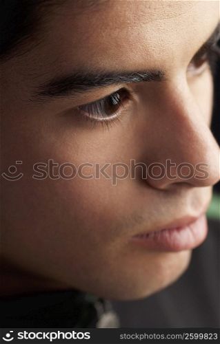 Close-up of a young man thinking