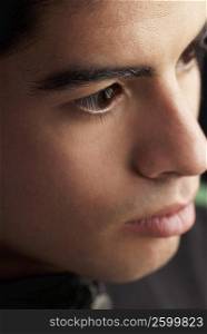 Close-up of a young man thinking