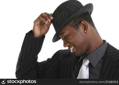 Close up of a young man tipping his hat.