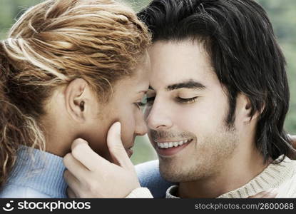 Close-up of a young man touching a young woman&acute;s face