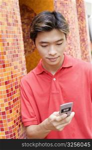 Close-up of a young man using a mobile phone