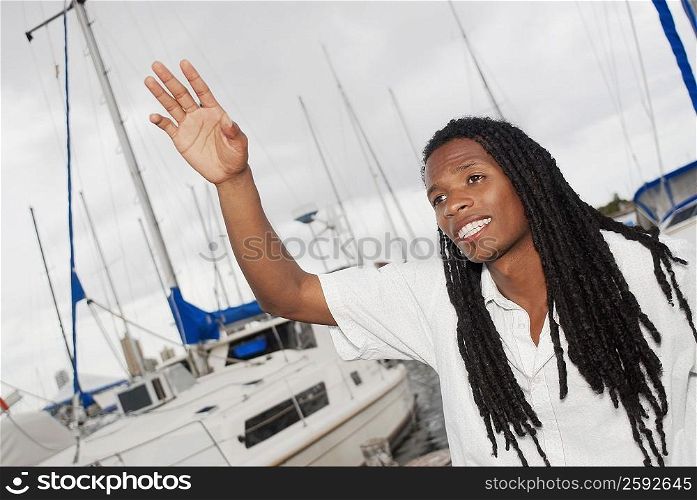 Close-up of a young man waving his hand