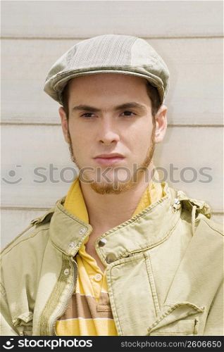 Close-up of a young man wearing a flat cap