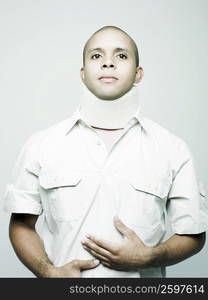 Close-up of a young man wearing a neck brace