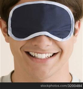 Close-up of a young man wearing an eye mask