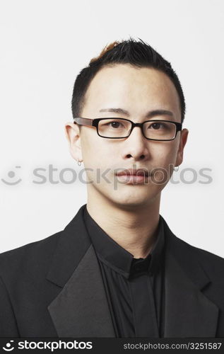 Close-up of a young man wearing eyeglasses