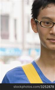 Close-up of a young man wearing eyeglasses