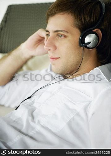 Close-up of a young man wearing headphones