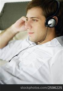 Close-up of a young man wearing headphones