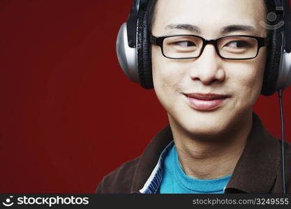 Close-up of a young man wearing headphones