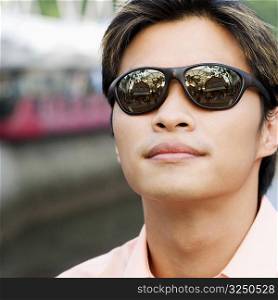 Close-up of a young man wearing sunglasses