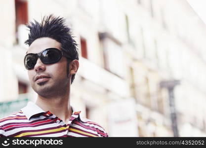 Close-up of a young man wearing sunglasses