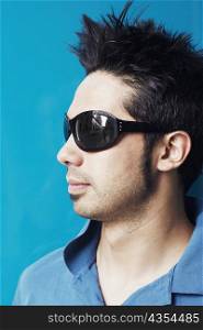 Close-up of a young man wearing sunglasses