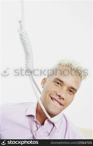 Close-up of a young man with a noose around his neck