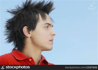 Close-up of a young man with spiky hair