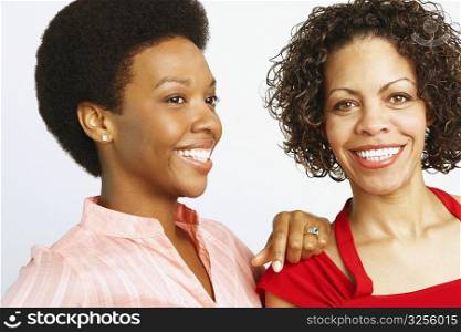 Close-up of a young woman and a mature woman smiling
