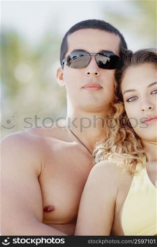 Close-up of a young woman and a mid adult man
