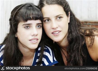 Close-up of a young woman and a teenage girl