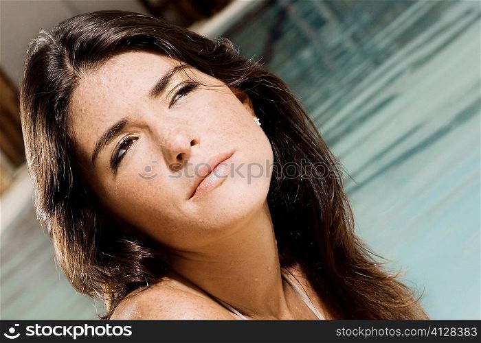 Close-up of a young woman at the poolside
