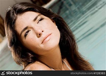 Close-up of a young woman at the poolside