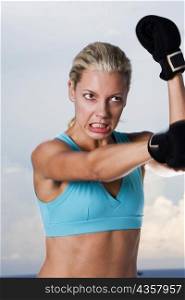 Close-up of a young woman boxing