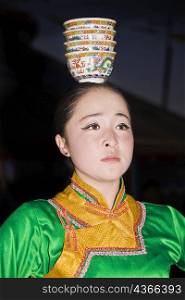 Close-up of a young woman dancing, Inner Mongolia, China