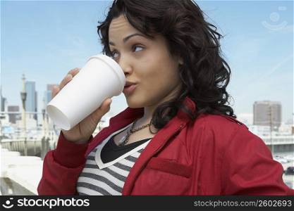 Close-up of a young woman drinking coffee