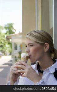 Close-up of a young woman eating an ice cream