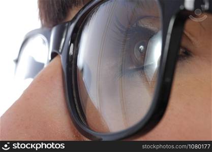 close-up of a young woman eye with black glasses