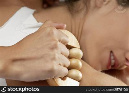 Close-up of a young woman getting a massage