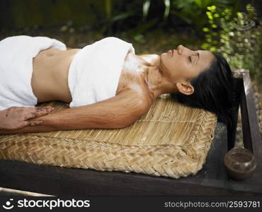 Close-up of a young woman getting spa treatment