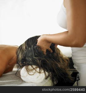 Close-up of a young woman getting spa treatment