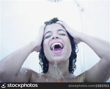 Close-up of a young woman having a shower