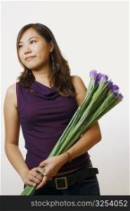 Close-up of a young woman holding a bouquet of flowers