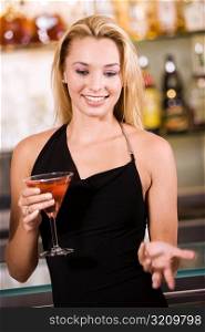 Close-up of a young woman holding a glass of wine