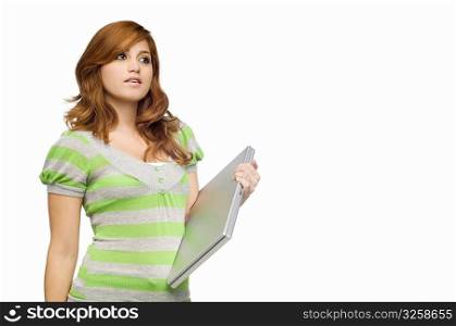 Close-up of a young woman holding a laptop